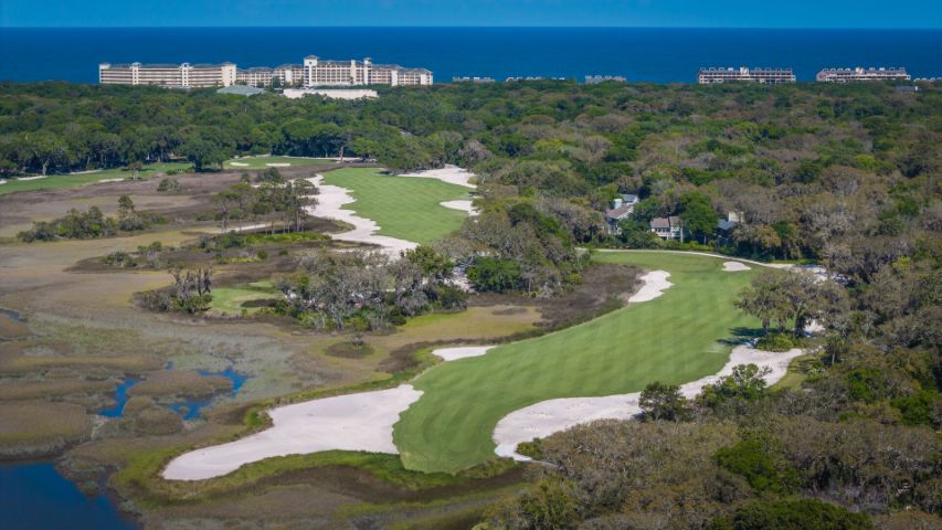 Aerial view of Omni Amelia Island golf course, marshland, and oceanfront resort.