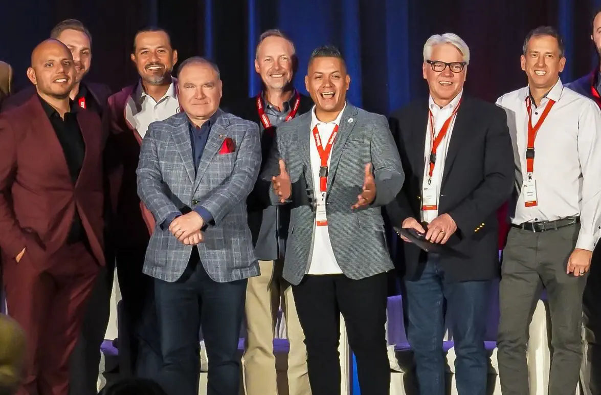 DealerConnect speakers and attendees gathered on stage.