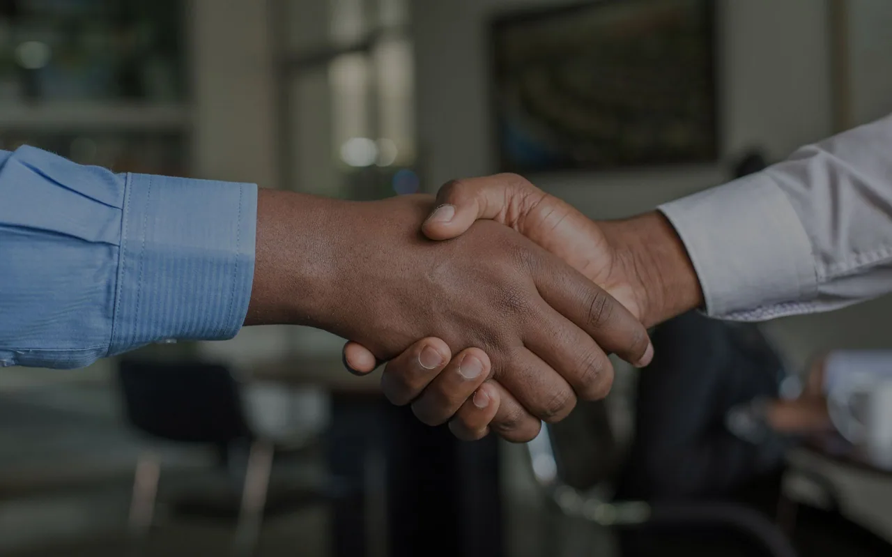 Business partners shaking hands.
